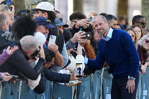 Britain's Prince William poses for pictures with members of the public as he joins cricketing stars from the United Kingdom and India at a special Earthshot Prize event in London, Tuesday, Oct. 13, 2026, ahead of the Earthshot Prize's annual Summit and Awards Night in Mumbai in November.
