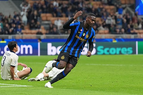 Inter Milan's Ange-Yoan Bonny gestures after scoring his side's third goal during the Champions League opening phase soccer match between Inter Milan and Club Brugge in Milan, Italy, Tuesday, Oct. 13, 2026.