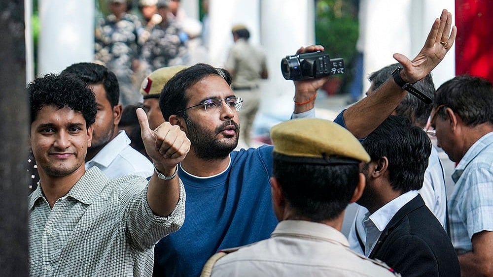 Cockroach Janta Party (CJP) leaders Saurav Das and Ashutosh Ranka arrive at the Parliament Street Police Station regarding permission and security clearance for party demonstrations, in New Delhi. - | Photo: PTI/Salman Ali