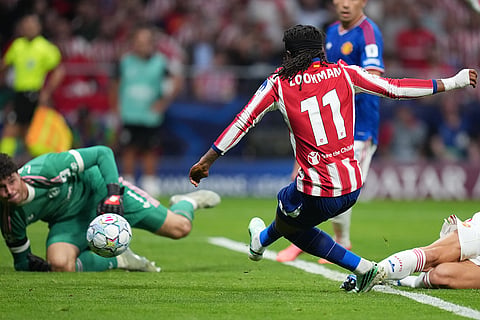 Atletico Madrid's Ademola Lookman scores their second goal during the Champions League opening phase soccer match between Atletico Madrid and Manchester United in Madrid, Tuesday, Oct. 13, 2026.