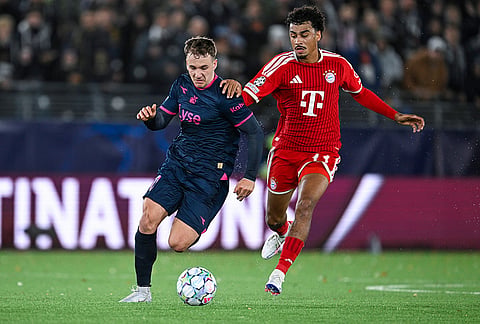 Viking's Peter Christiansen, left, and Bayern Münich's Nathaniel Brown in action during the Champions League opening phase soccer match between Viking and Bayern Munich in Stavanger, Norway, Tuesday Oct. 13, 2026. 