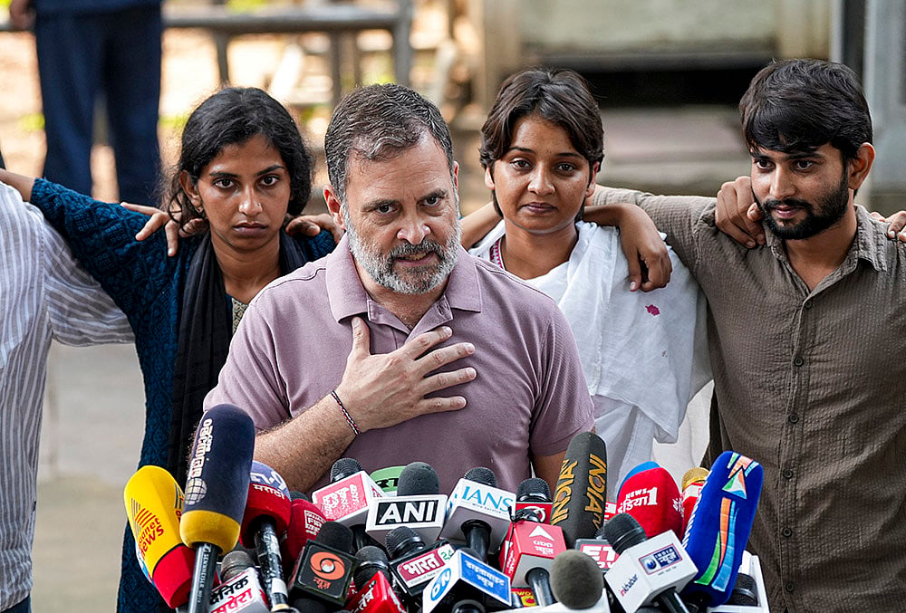 Congress leader Rahul Gandhi with NSUI members and other protesters, who were allegedly injured amid crackdown by police in the recent protests against Chief Election Commissioner (CEC) Gyanesh Kumar, during a press conference after their meeting, in New Delhi, Wednesday, Oct. 14, 2026.  - | Photo: PTI/Arun Sharma