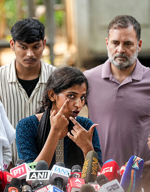Congress leader Rahul Gandhi with NSUI members and other protesters, who were allegedly injured amid crackdown by police in the recent protests against Chief Election Commissioner (CEC) Gyanesh Kumar, during a press conference after their meeting, in New Delhi, Wednesday, Oct. 14, 2026. 