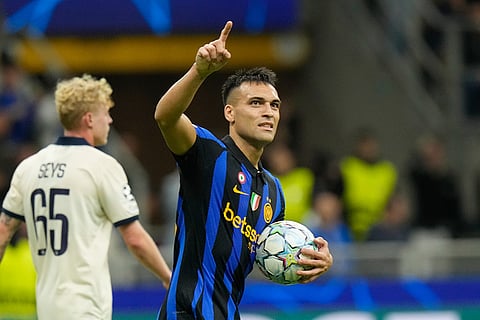 Inter Milan's Lautaro Martinez celebrates after scoring his side's second goal during the Champions League opening phase soccer match between Inter Milan and Club Brugge in Milan, Italy, Tuesday, Oct. 13, 2026.