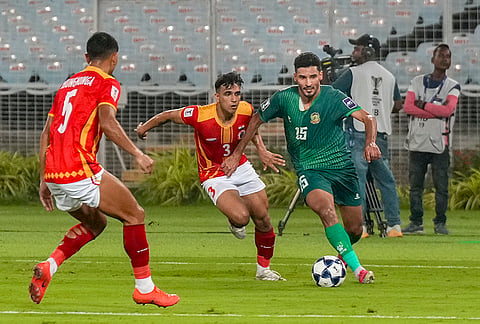 East Bengal FC player and Al Shorta FC player vie for the ball during the AFC Champions League Two football match, in Kolkata, Tuesday, Oct. 13, 2026. 