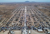 | Photo: AP/Baderkhan Ahmad : Trucks packed with belongings line the roads at al-Talayi camp as displaced families get ready to return to the Ras al-Ayn countryside, in Hassakeh, Syria, Tuesday, Oct. 13, 2026. Around 450 families are making the journey after seven years of displacement following a Turkish military offensive in 2019. 