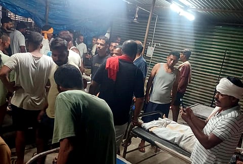 People gather at a local hopital after a boat capsized in the Ganga river, with several people feared drowned, in Bihar's Vaishali district on Tuesday, Oct. 13, 2026. 
