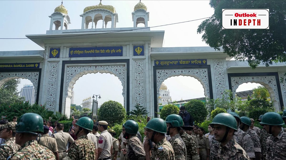 Security personnel stand guard outside the entrance gate of Gurdwara Bangla Sahib in New Delhi - Karma/ PTI