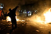| Photo: AP/Hameraldi Agolli : A protester throws a stone at police during clashes in Tirana, Albania, Tuesday, Oct. 13, 2026, joining a demonstration organized by the Flamingo protest movement demanding the resignation of Prime Minister Edi Rama. 