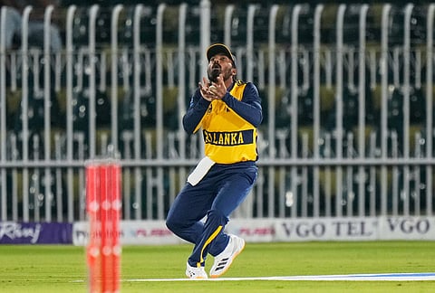 Sri Lanka's Lahiru Udara takes a catch to dismiss Pakistan's Fakhar Zaman, right, during the third T20 cricket match between Pakistan and Sri Lanka, in Rawalpindi, Pakistan, Tuesday, Oct. 13, 2026. 