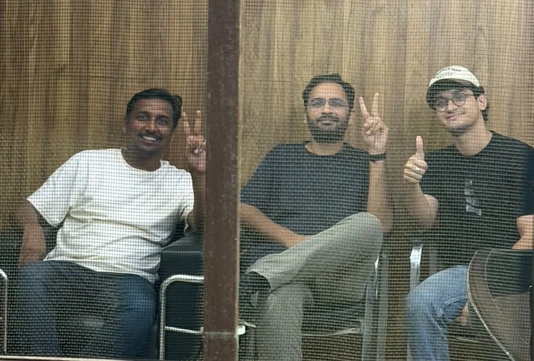 Cockroach Janata Party (CJP) National Organisation In-charge Ajinkya Shinde along with CJP Co-Conveners Ashutosh Ranka and Saurav Das inside the Parliament Street Police Station, in New Delhi. Das and Ranka were sent to five-day judicial custody and lodged in Tihar Jail on Wednesday for allegedly violating their peace bonds and trespassing into the denotified protest site at Jantar Mantar, while their associate Shinde was released on a personal bond of Rs 5,000 and a surety of the same amount after being bound down to maintain peace and good behaviour for six months. - | Photo: @abhijeet_dipke/X via PTI