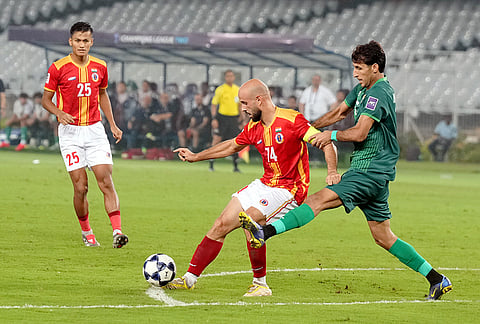 East Bengal FC player and Al Shorta FC player vie for the ball during the AFC Champions League Two football match, in Kolkata, Tuesday, Oct. 13, 2026. 