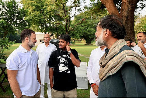 Lok Sabha LoP Rahul Gandhi with activist Yogendra Yadav and others during a high tea organised for the INDIA bloc leaders at his residence, to discuss the strategy for joint protests against ‘vote chori’ (vote theft) and to press for Chief Election Commissioner Gyanesh Kumar's resignation, in New Delhi. 
