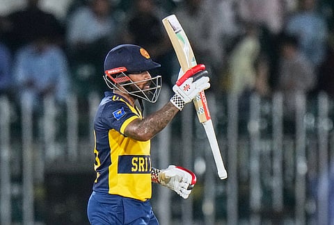Sri Lanka's Kusal Mendis celebrates after scoring fifty runs during the third T20 cricket match between Pakistan and Sri Lanka, in Rawalpindi, Pakistan, Tuesday, Oct. 13, 2026. 