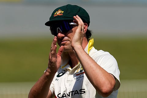 Australia's captain Pat Cummins clap hands at then of day five of the first cricket test match between South Africa and Australia, in Durban, South Africa, Tuesday, Oct. 13, 2026.