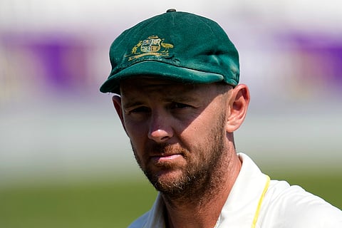 Australia's Josh Hazlewood looks on following their victory in the first cricket test match against South Africa, in Durban, South Africa, Tuesday, Oct. 13, 2026.