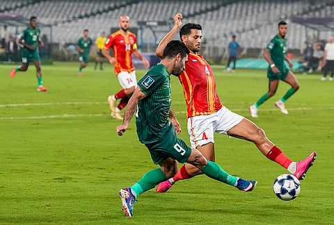 East Bengal FC player and Al Shorta FC player vie for the ball during the AFC Champions League Two football match, in Kolkata, Tuesday, Oct. 13, 2026.
