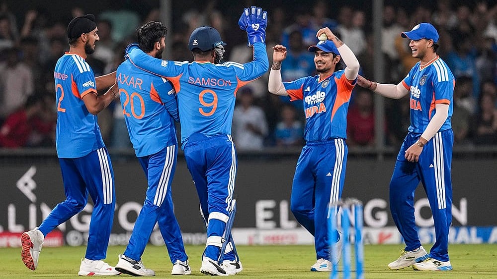 India's Axar Patel, second left, celebrates with teammates after taking the wicket of West Indies' Rovman Powell during the third T20I cricket match of a series between India and West Indies, in Indore, Madhya Pradesh, Sunday, Oct. 11, 2026.  - | Photo: PTI/Kunal Patil