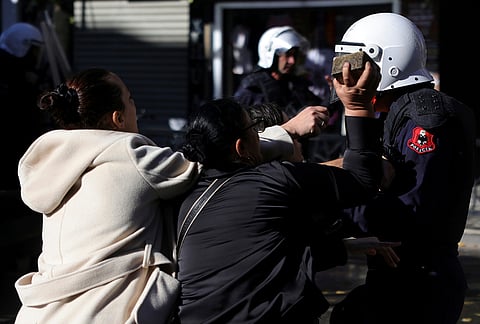 Protesters confront riot police during clashes in Tirana, Albania, Tuesday, Oct. 13, 2026, joining a demonstration organized by the Flamingo protest movement demanding the resignation of Prime Minister Edi Rama. 