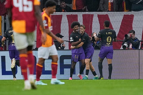 Barcelona's Karim Adeyemi, left, celebrates with teammates after scoring his side's fourth goal during the Champions League opening phase soccer match between Galatasaray and Barcelona in Istanbul, Turkey, Tuesday, Oct. 13, 2026.