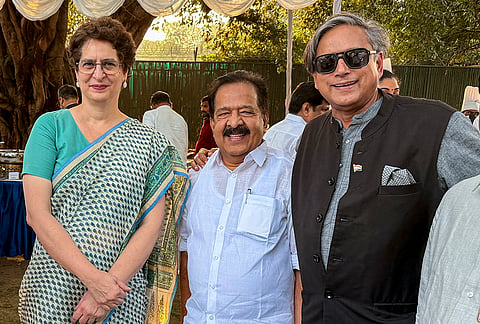 Congress MP Priyanka Gandhi Vadra in a photograph with party MP Shashi Tharoor and Keralam Minister Ramesh Chennithala during a high tea organised for INDIA bloc leaders at LoP Rahul Gandhi’s residence, to discuss the strategy for joint protests against ‘vote chori’ (vote theft) and to press for Chief Election Commissioner Gyanesh Kumar's resignation, in New Delhi. 