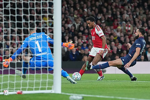 Arsenal's Jurrien Timber scores first goal during the UEFA Champions League soccer match between Arsenal and Lille in London, Tuesday, Oct. 13, 2026.