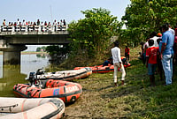 | Photo: PTI : Rescue operation underway to trace any missing occupants of a boat that capsized in the Ganga River a day ago, resulting in the death of at least 13 children, at Hajipur, in Bihar's Vaishali district, Wednesday, Oct. 14, 2026. 