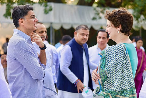 Congress leader Priyanka Gandhi Vadra interacts with party leader Sachin Pilot during a high tea organised for the INDIA bloc leaders at Rahul Gandhi’s residence, to discuss the strategy for joint protests against ‘vote chori’ (vote theft) and to press for Chief Election Commissioner Gyanesh Kumar's resignation, in New Delhi. 
