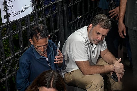 Lok Sabha Leader of Opposition (LoP) Rahul Gandhi with the parents of Ankita Bhandari during a sit-in protest at India Gate, in New Delhi, Wednesday, Oct. 14, 2026. LoP Rahul Gandhi and Priyanka Gandhi joined the family to express solidarity with their demand to put on hold the gubernatorial appointment of a BJP leader whose name they allege is linked to the case.