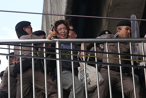 Police officers push protesters during a demonstration march to the International Monetary Fund and the World Bank Group meetings in Bangkok, Thailand, Thursday, Oct. 15, 2026. 