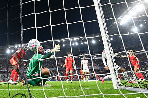 LASK's Robert Ljubicic, right, scores his side's first goal during the Champions League opening phase soccer match between LASK and Liverpool in Linz, Austria, Wednesday, Oct. 14, 2026.