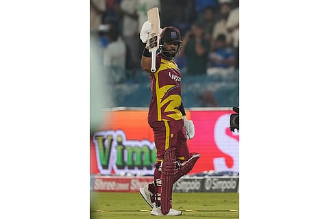 West Indies' captain Shai Hope celebrates his century during the fourth T20 cricket match between India and West Indies in Hyderabad, India, Wednesday, Oct. 14, 2026.