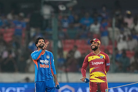 India's team captain Shreyas Iyer, left, toss a coin as West Indies' team captain Shai Hope watch it during the fourth T20 cricket match between India and West Indies in Hyderabad, India, Wednesday, Oct. 14, 2026.