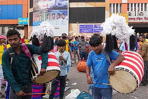 | Photo: PTI/Swapan Mahapatra : Dhakis, traditional Bengali drummers, display their skills as they arrive at Sealdah railway station from rural areas, hoping to be hired by Durga Puja committees for the remaining four days of the festival, in Kolkata, West Bengal, Thursday, Oct. 15, 2026.