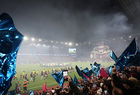 Fans cheer ahead of the Champions League opening phase soccer match between Aston Villa and Fenerbahce in Birmingham, England, Wednesday Oct. 14, 2026. 