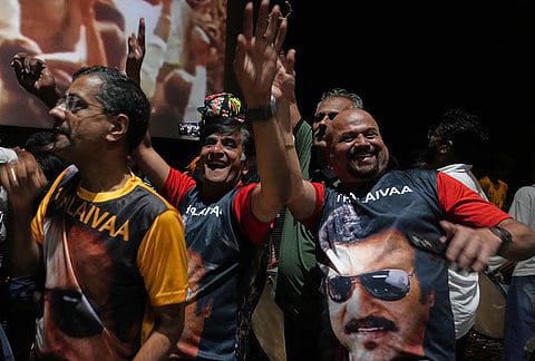 Fans of Indian superstar Rajinikanth cheer as they celebrate a screening of his latest film, "Jailer 2," at a cinema hall in Mumbai, India, Thursday, Oct. 15, 2026.