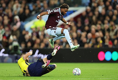 Fenerbahce's Ognjen Mimovic, left, challenges Aston Villa's Aaron Wan-Bissaka during the Champions League opening phase soccer match between Aston Villa and Fenerbahce in Birmingham, England, Wednesday Oct. 14, 2026. 
