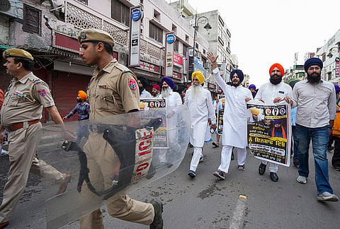 Activists of Akali Dal (Waris Punjab De) stage a protest during a bandh called to protest the killing of anti-drug activist Parvinder Singh alias Jhota in Mansa, in Amritsar, Punjab, Thursday, Oct. 15, 2026. 

