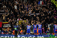 PSG Stun City 4-2 As Erling Haaland's Brace Goes In Vain At Etihad Stadium | Photo: AP/Dave Thompson : PSG supporters and players celebrate at the end of the Champions League opening phase soccer match between Manchester City and Paris Saint-Germain in Manchester, England, Wednesday, Oct. 14, 2026.