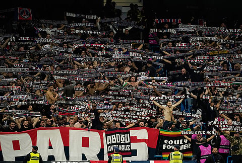PSG supporters cheer during the Champions League opening phase soccer match between Manchester City and Paris Saint-Germain in Manchester, England, Wednesday, Oct. 14, 2026.

