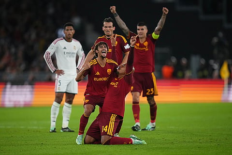 Roma's Donyell Malen celebrates with his teammates after scoring his side's third goal during a Champions League opening phase soccer match between Roma and Real Madrid, in Rome, Wednesday, Oct.14, 2026.