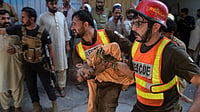 | Photo: AP/Muhammad Zubair : Rescue workers carry an injured boy after rescuing him from the rubble of a roof collapse at a private school, in Peshawar, Pakistan, Thursday, Oct. 15, 2026.