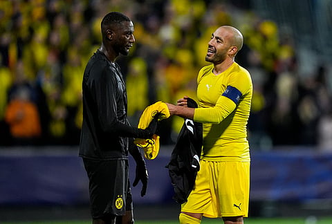 Bodø/Glimts Haitam Aleesami trades shirt with Borussia Dortmunds Sehrou Guirassy, left. after the Champions League soccer match between Bodo/Glimt and Borussia Dortmund in Bodo, Norway, Wednesday, Oct. 14, 2026. 
