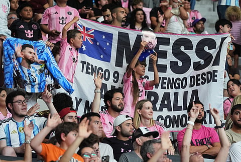 Fans hold up a sign in support of Inter Miami forward Lionel Messi during the second half of an MLS soccer match between Inter Miami and New York City FC, Wednesday, Oct. 14, 2026, in Miami. 