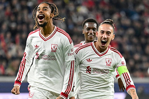 Liverpool's Bradley Barcola, left, celebrates after scoring his side's second goal during the Champions League opening phase soccer match between LASK and Liverpool in Linz, Austria, Wednesday, Oct. 14, 2026.