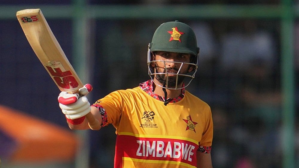 Zimbabwe's captain Sikandar Raza celebrates his fifty runs during the T20 World Cup cricket match between South Africa and Zimbabwe in New Delhi. - | Photo: AP/Manish Swarup