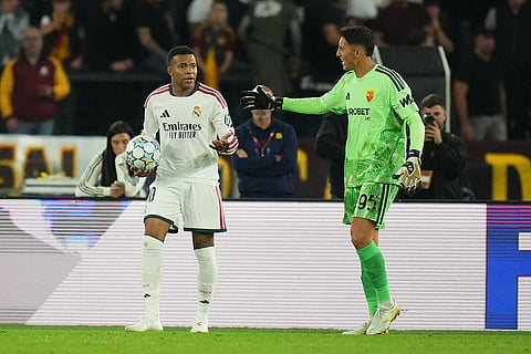 Real Madrid's Kylian Mbappe argues with Roma's goalkeeper Pierluigi Gollini after referee François Letexier disallowed his goal during a Champions League opening phase soccer match between Roma and Real Madrid, in Rome, Wednesday, Oct.14, 2026.