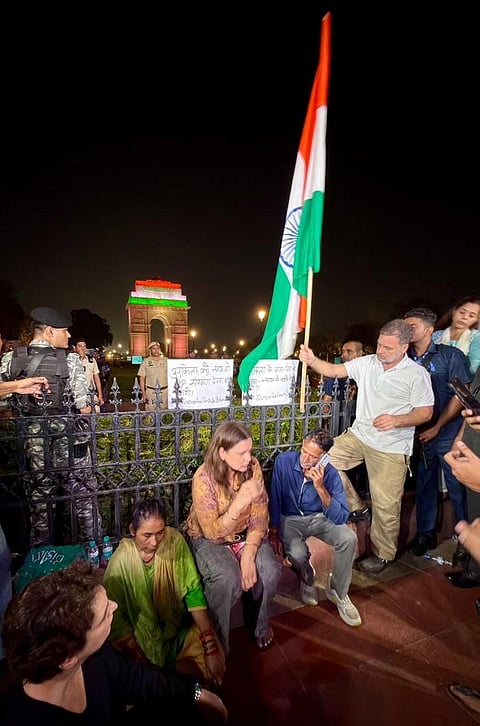 In this image posted on Oct. 14, 2026, Lok Sabha Leader of Opposition (LoP) Rahul Gandhi with the parents of Ankita Bhandari during a sit-in protest at India Gate, in New Delhi. LoP Rahul Gandhi and Priyanka Gandhi joined the family to express solidarity with their demand to put on hold the gubernatorial appointment of a BJP leader whose name they allege is linked to the case.