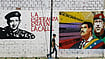 New Torture Allegations Expand US Prosecution Of Venezuela’s Maduro | Photo: Imago/Zuma Press Wire : Leaders on the Wall: A man walks past grafitti in Valencia city, Venezuela, depicting Nicolás Maduro, Simón Bolivar and Hugo Chávez