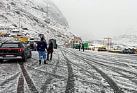 | Photo: PTI : Tourists arrive at the North Portal of the Atal Tunnel amid fresh snowfall, in Kullu district, Himachal Pradesh, Thursday, Oct. 15, 2026. 